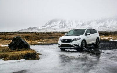 white Honda SUV on gray floor